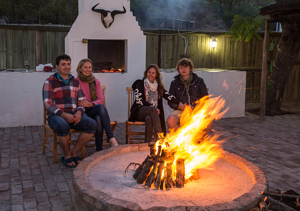 Guests next to fire at Olive Grove Guests next to fire at Olive Grove